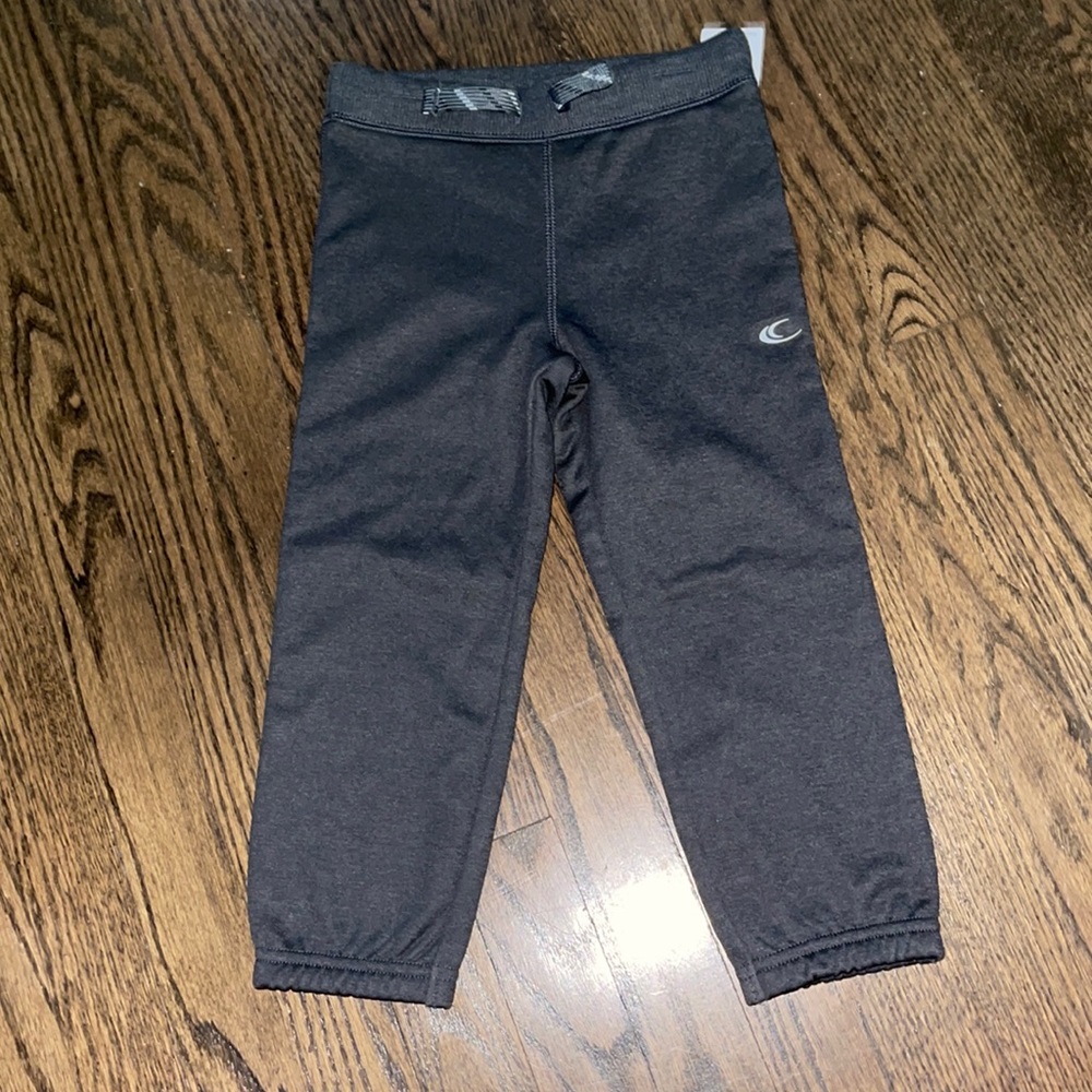 Grey joggers.  Soft and cozy material inside.  The little one will be warm